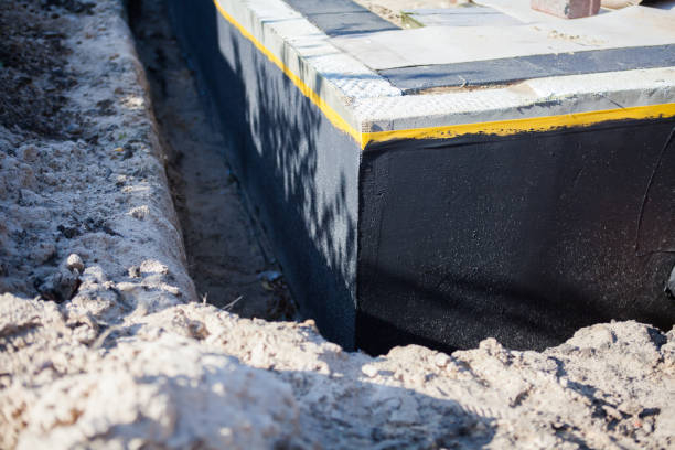 Professional Waterproofing technician working in Monroeville, PA